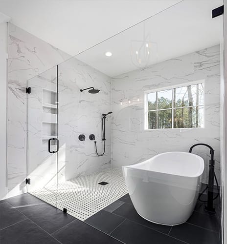 Wide view of a bathroom fully remodeled with a new standing shower